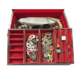 A leather cased jewellery box containing a large quantity of white metal and other costume jewellery