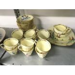 The residue of a Crown Stafford china tea set in the Art Deco style decorated with flowers, 748202.