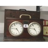 A mid 20th century oak cased Chess timing clock with original wooden carrying case.