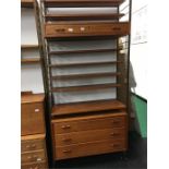 Teak wall unit with cupboards underneath.