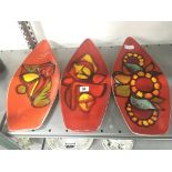 Three Poole pottery Delphis Spear dishes, shape 82 decorated in abstract designs in tones of red,