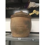 A large terracotta Verwood Pottery ovoid shaped lidded egg crock.