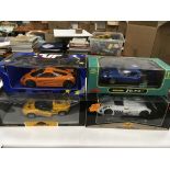 Four 1/18 scale diecast racing cars: Chrono Lotus Elise 1997 'Norfolk Mustard'; UT Models Mclaren F1