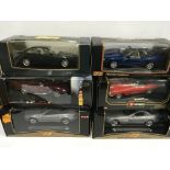 Six 1/18 scale diecast cars by Maisto, Bburago and Shell, includes Jaguar XK8 and BMW 850i. Appear