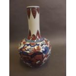 A Chinese porcelain long necked vase decorated with blue and white kylin with iron red highlights, 4