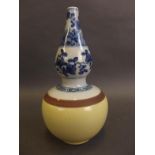 A Chinese porcelain bottle vase, the upper part decorated with blue and white flowers over and ochre