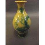 A Chinese porcelain vase with green dragon decoration on a yellow ground, seal mark to base, 6" high