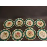 A Victorian nine piece hand decorated porcelain dessert set decorated with flowers, 9" diameter