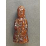 A small carved horn figure Quan of Yin, 3" long