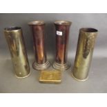 A collection of WWI memorabilia to include two brass shell case vases engraved 'Somme', a