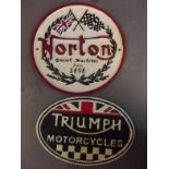 Two cast metal advertising signs 'Triumph Motorcycles' and 'Norton', 9" x 6"