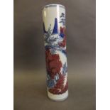 A Chinese porcelain cylindrical spill vase decorated with landscape scenes in blue and white with