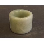 A pale green jade archers ring, 1½" diameter