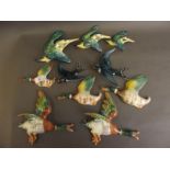 A set of three Beswick figures of flying kingfishers, no. 729, five various flying ducks, and two