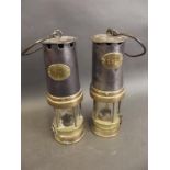 A pair of early miner's safety lamps by 'Patterson Lamps Ltd., Gateshead', 10" high