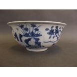 A Chinese blue and white porcelain bowl decorated with boys in a garden, 6" diameter