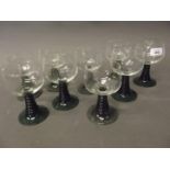 A set of nine Continental Hock drinking glasses with ribbed green stems, c1970, 5½'' high