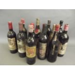 A collection of thirteen bottles of various wines, including 'Chateau Des Faures cotes de