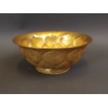 A Chinese gilt metal bowl of lotus flower form with engraved animal and foliate decoration, 5"