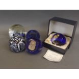 A collection of five Caitness Art glass paperweights including 'Glamis Rose' commemorating the Queen