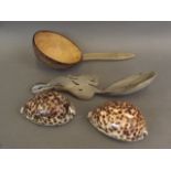 A coconut and horn ladle, a carved horn ladle, and two decorative shells, 9" long