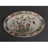 A Chinese polychrome enamel oval porcelain dish decorated with twin birds amongst blossom, 4