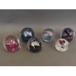 A collection of six Caithness Art glass paperweights including designs 'Sweetheart', 'Goldrush', '