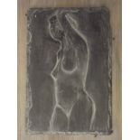 A carved slate tile depicting a nude female, 6" x 9"