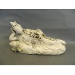 A large Chinese Blanc de Chine figure of Quan Yin reclining upon a lotus flower, seal mark