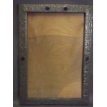 An Arts & Crafts pewter picture frame set with blue stones, 20½" x 14½"