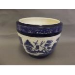 A Minton blue and white porcelain jardinière decorated with a variation of the Willow pattern, 10"