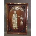 A Chinese rosewood panel with Mother of Pearl inlaid decoration of a woman with a parasol and fan,