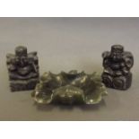 Two Oriental soapstone carvings of seated deities, together with a small soapstone dish carved as