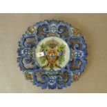 A hand painted Portuguese faience charger with pierced border, 14" diameter