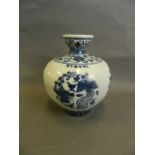 A Chinese Ming style bulbous porcelain vase with painted phoenix decoration in the blue and white