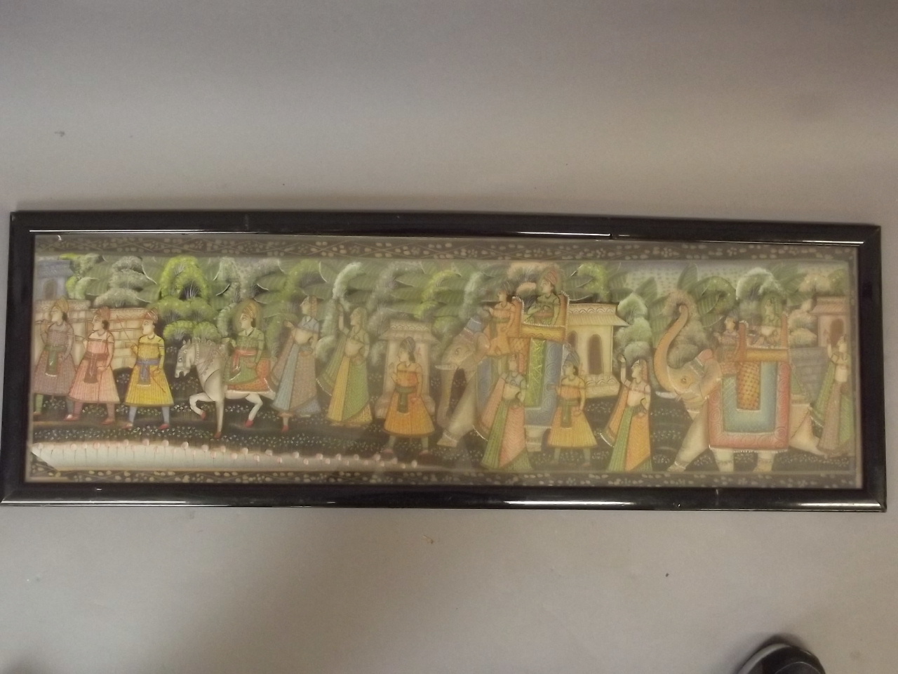 An Indian gouache of a grand procession with many figures and elephants, 36" x 10"