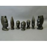 A collection of seven African hardwood carved heads, largest 8"