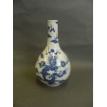 A Chinese blue and white porcelain bottle vase decorated with dragons chasing the flaming pearl,