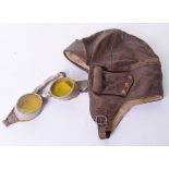 1930’s Aviators Flying Helmet being a short pattern brown leather helmet with rolled ear pieces