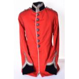 East Lancashire Regiment Officers Dress Tunic, of scarlet cloth with blue / black velvet collar