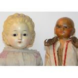 Wax over composition pumpkin head doll, German circa 1860, with glass pupil-less eyes, painted mouth
