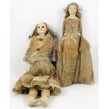 Two wax over composition slit-head dolls, English circa 1840, both with black inserted glass eyes,