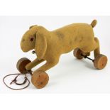 Early Steiff felt rabbit on wheels, circa 1909, the brown straw filled rabbit with black boot button