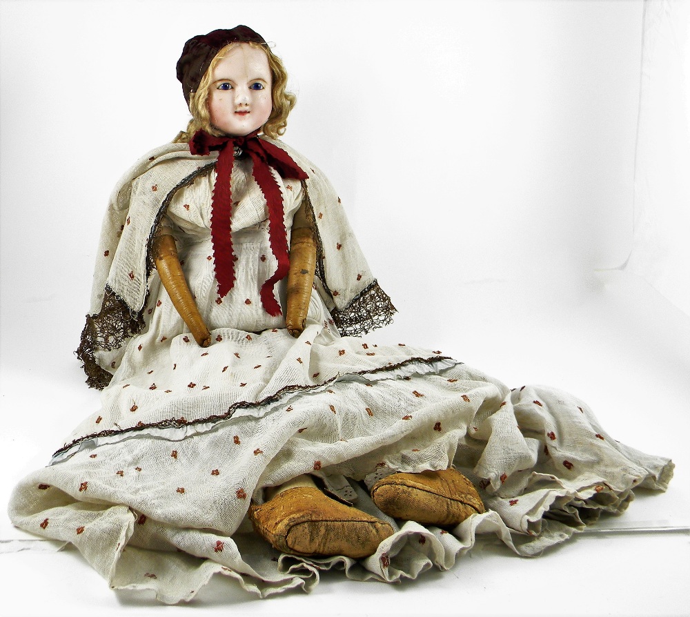 Large wax over composition shoulder head doll, English circa 1840, with bright blue glass eyes,