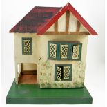 Tri-ang dolls house and quantity of period furniture, 1930s, the painted cream exterior with mock
