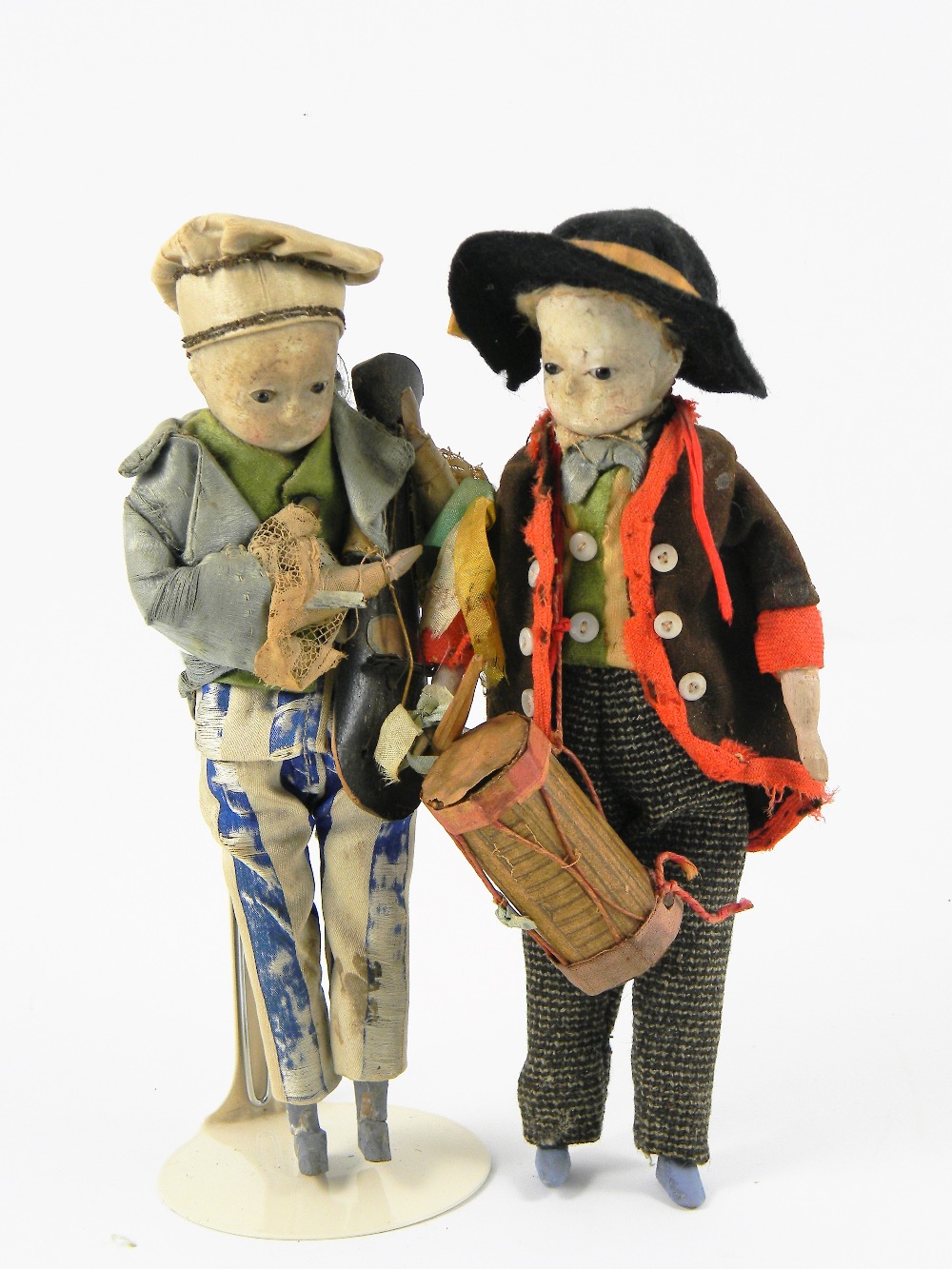 Pair of wax head Travelling Musician dolls, German circa 1860, both with black glass eyes, drummer