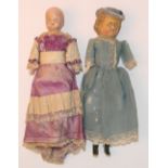 Four small early German dolls, including a mechanical wax over composition baby in pram with glass