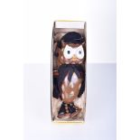 Pelham Puppet Owl, carved and painted head and body, wearing black cape and schoolmasters hat,