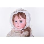 A Large size 13 closed mouth Depose Tete Jumeau, circa 1890, with large blue paper-weight eyes,