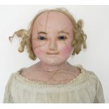Large wax over composition shoulder head doll, English circa 1850, with blue glass eyes, painted